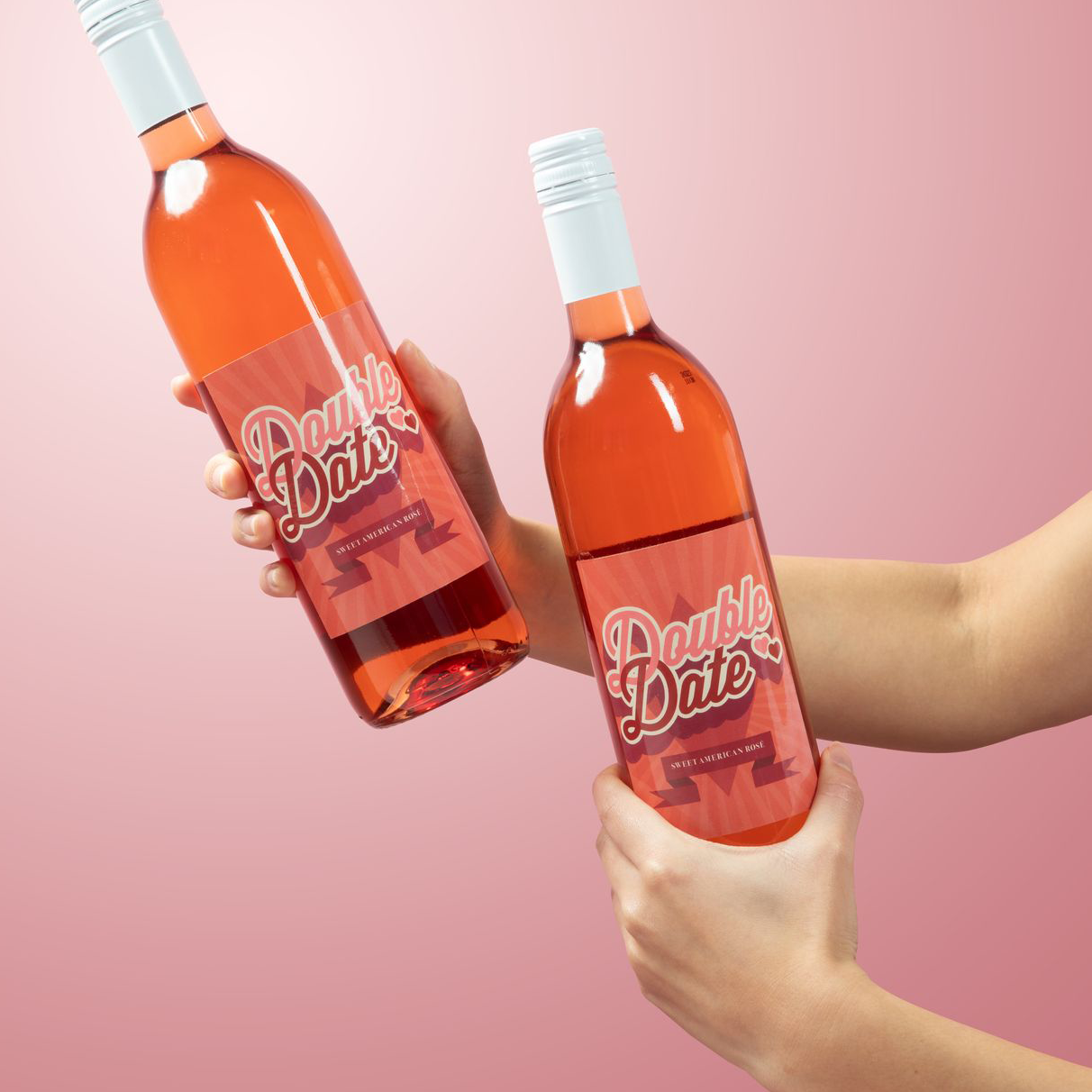 Woman holding two bottles of Double Date Sweet Rosé
